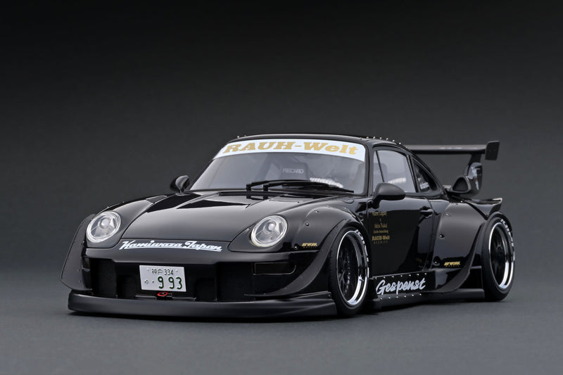IG2719 RWB 993 Silver With Mr. Nakai sitting on sofa 1:18
